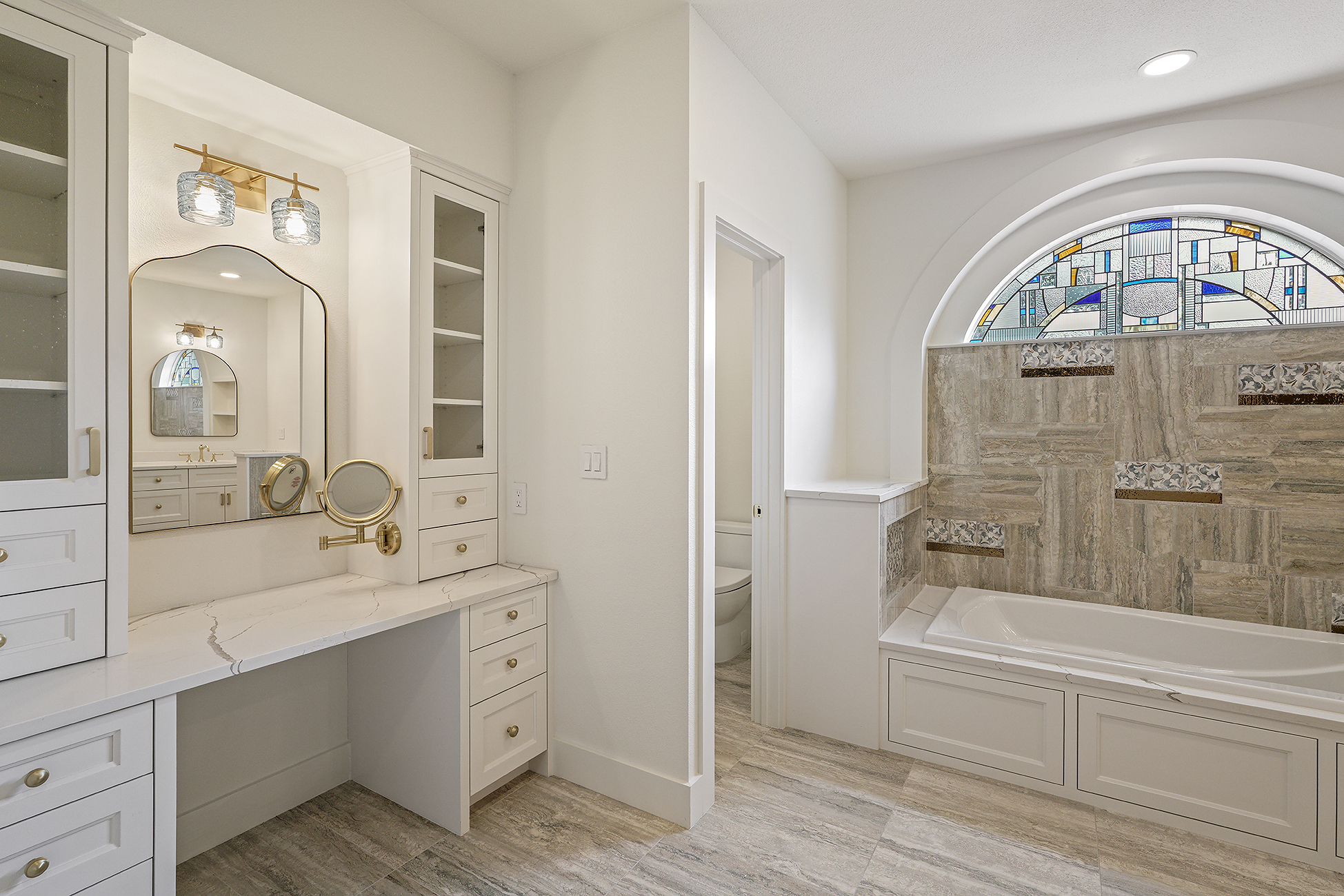 Terrell Hills bathroom renovation showing upgraded shower tile, vanity area, and refreshed lighting by Texas Highlands Custom Homes & Remodel.