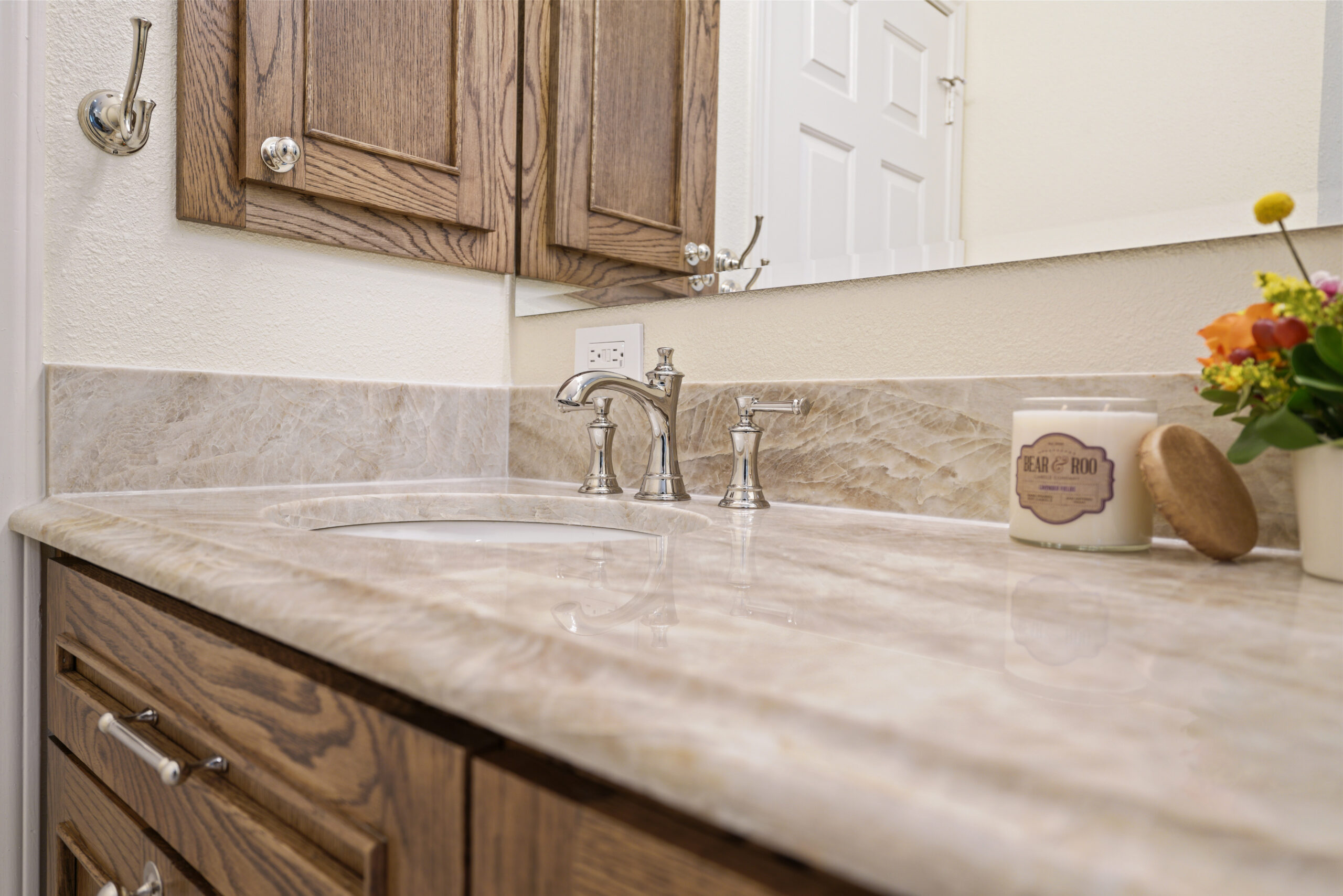 Luxury bathroom remodel with Taj Mahal quartzite countertops.