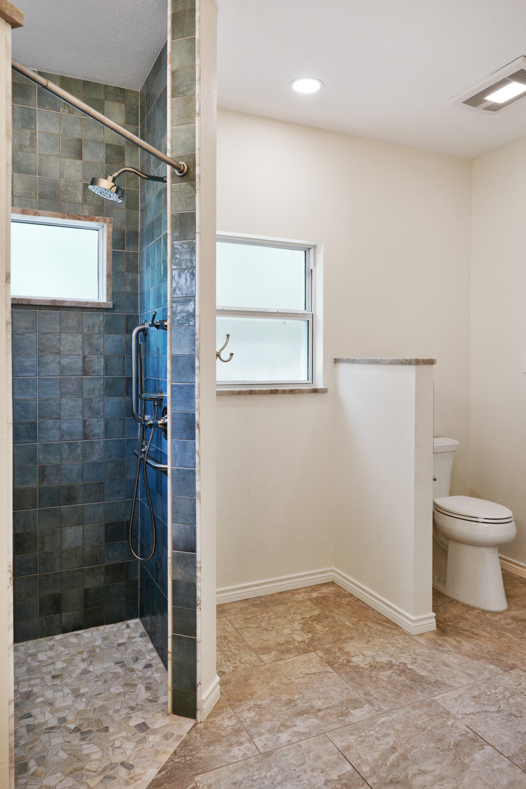 Luxury bathroom remodel in San Antonio, Texas with pony wall.
