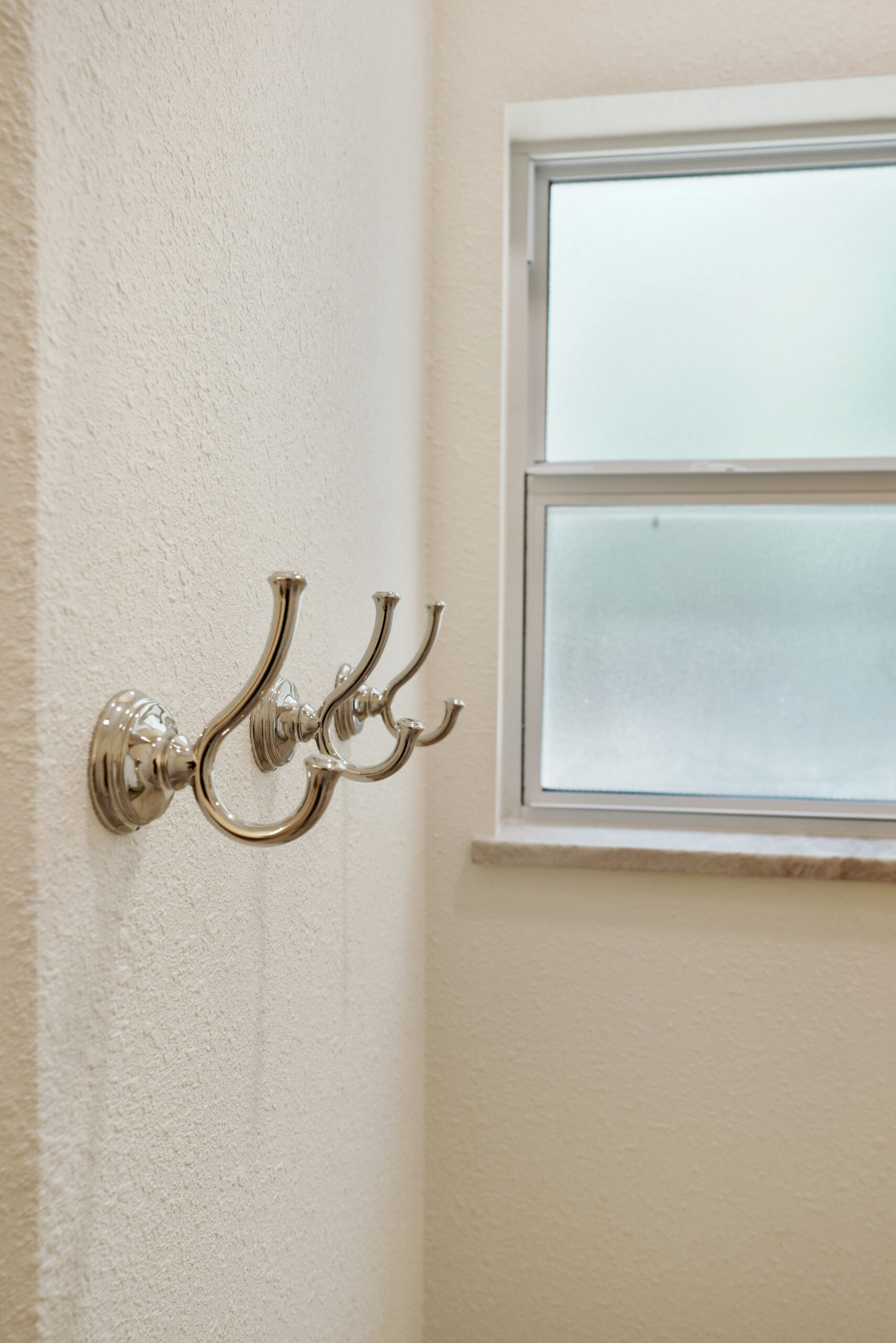Delicate hooks in new bathroom remodel.
