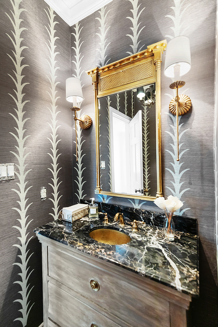 Custom powder room with a vanity by Texas Highlands Custom Homes & Remodel