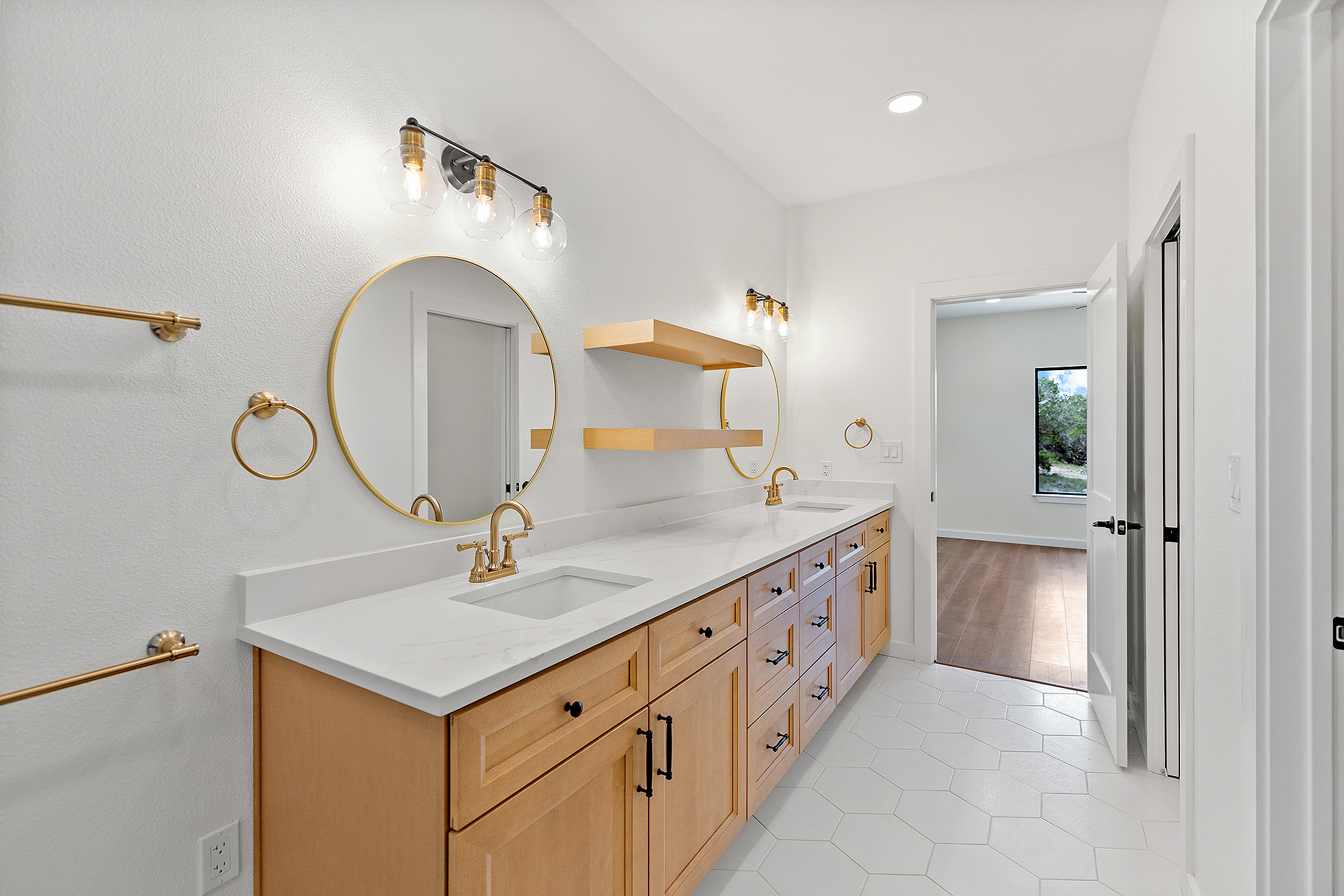 Double vanity with framed mirrors and modern fixtures