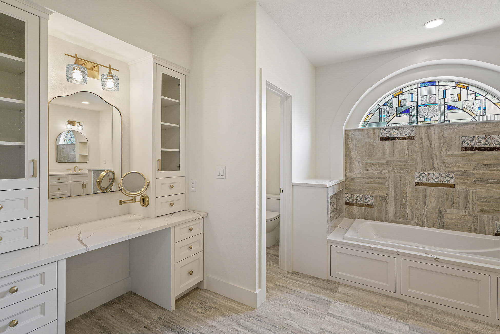 Spa-style primary bathroom with a tub and walk-in shower